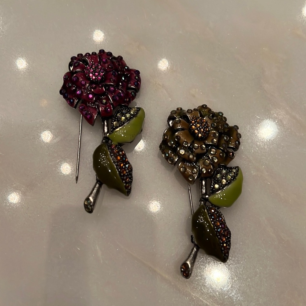 Two flower brooches